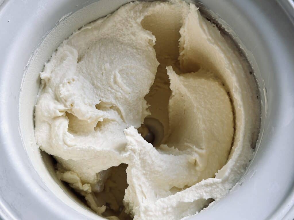 Homemade vanilla ice cream in an ice cream machine.