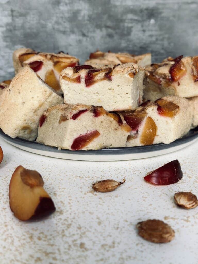 Lots of sliced plum cakes on a plate