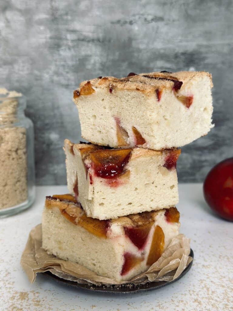 A stack of 3 plum cake squares