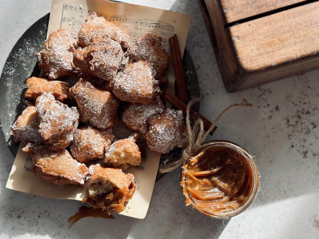 Spiced donut bites dipped in a burnt caramel sauce