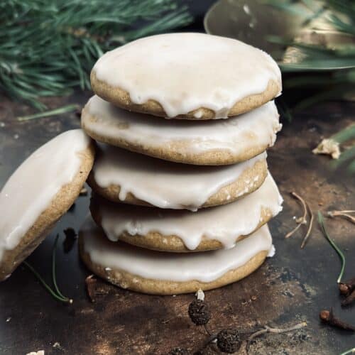 A stack of gingerbread cookies topped with a sugar glaze.