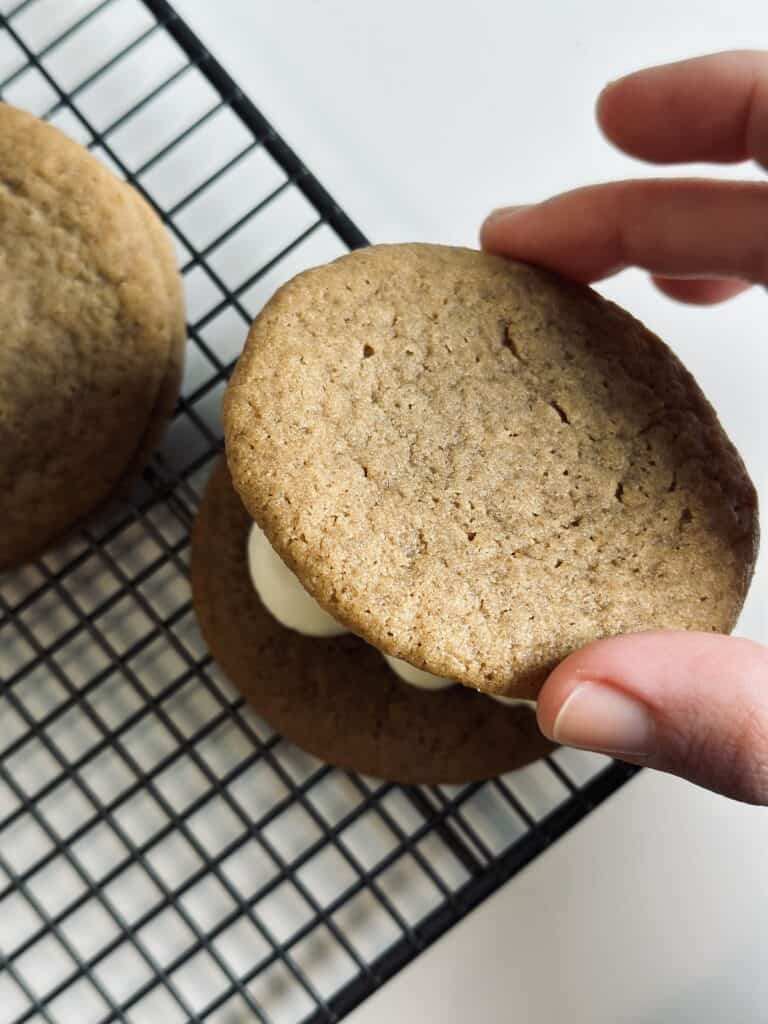 Assembling a cookie sandwich.