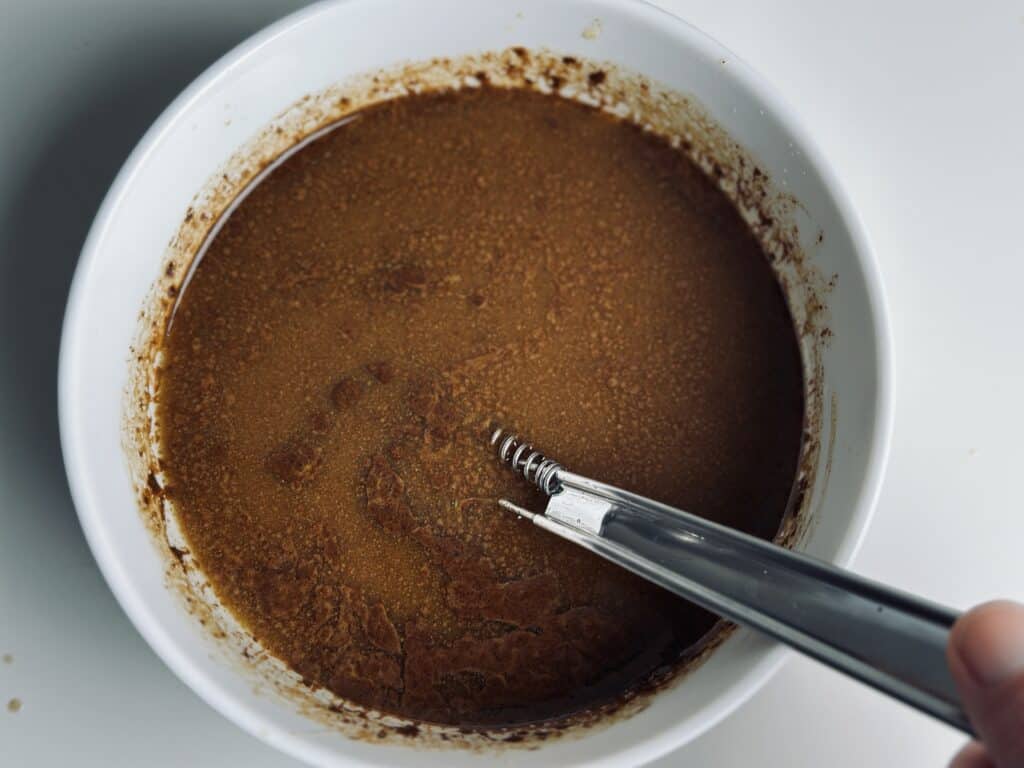 A bowl with a mixture of butter and instant coffee.