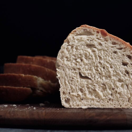 A sourdough sandwich bread sliced in half