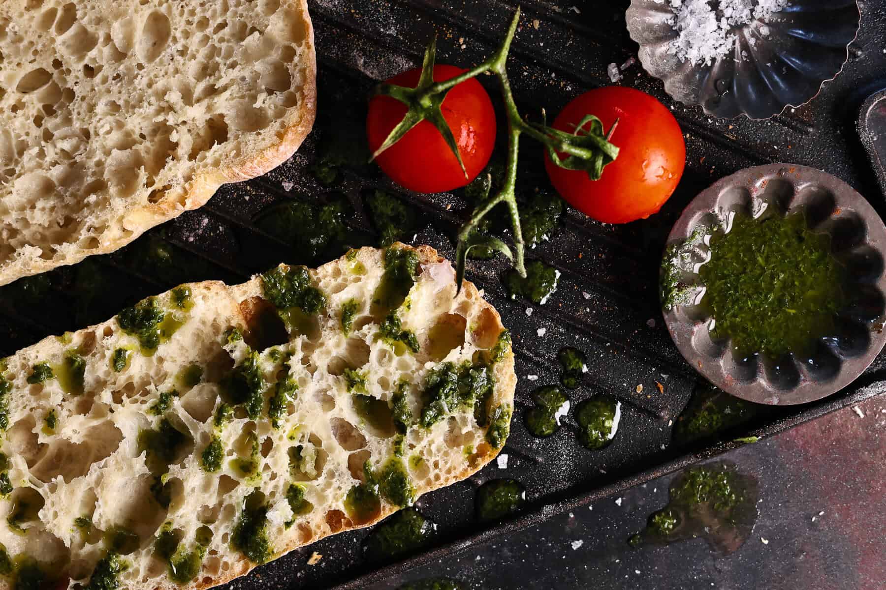 Sourdough ciabatta bread topped with pesto.