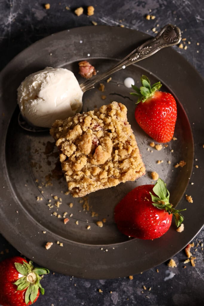 Sourdough discard strawberry coffee cake served with a scoop of ice cream.